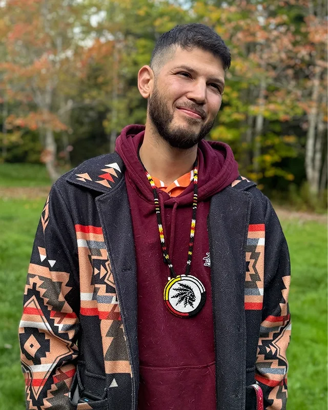 Clinton Ray Howard, founder of Glooscap's Finest, wearing a Glooscap's Finest medallion