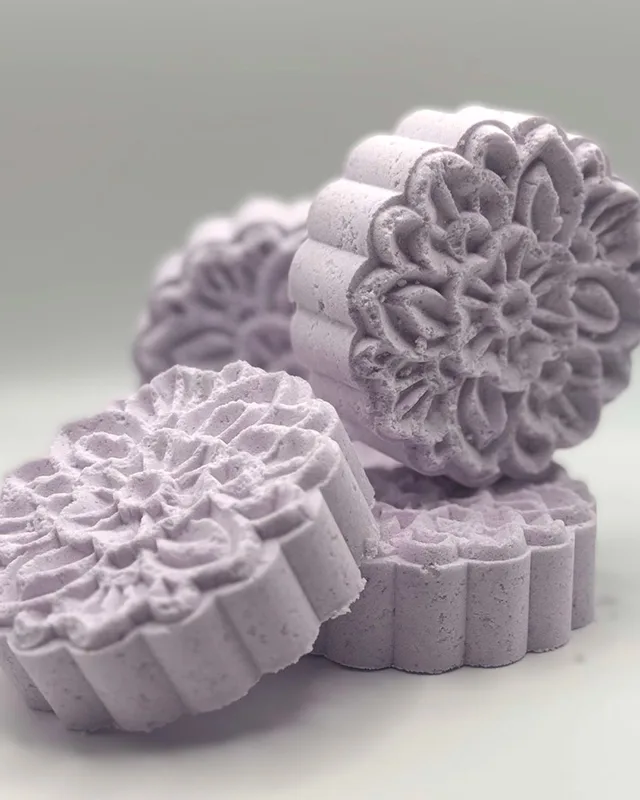 Lavender Glooscap's Finest bath bombs pressed in a flower pattern
